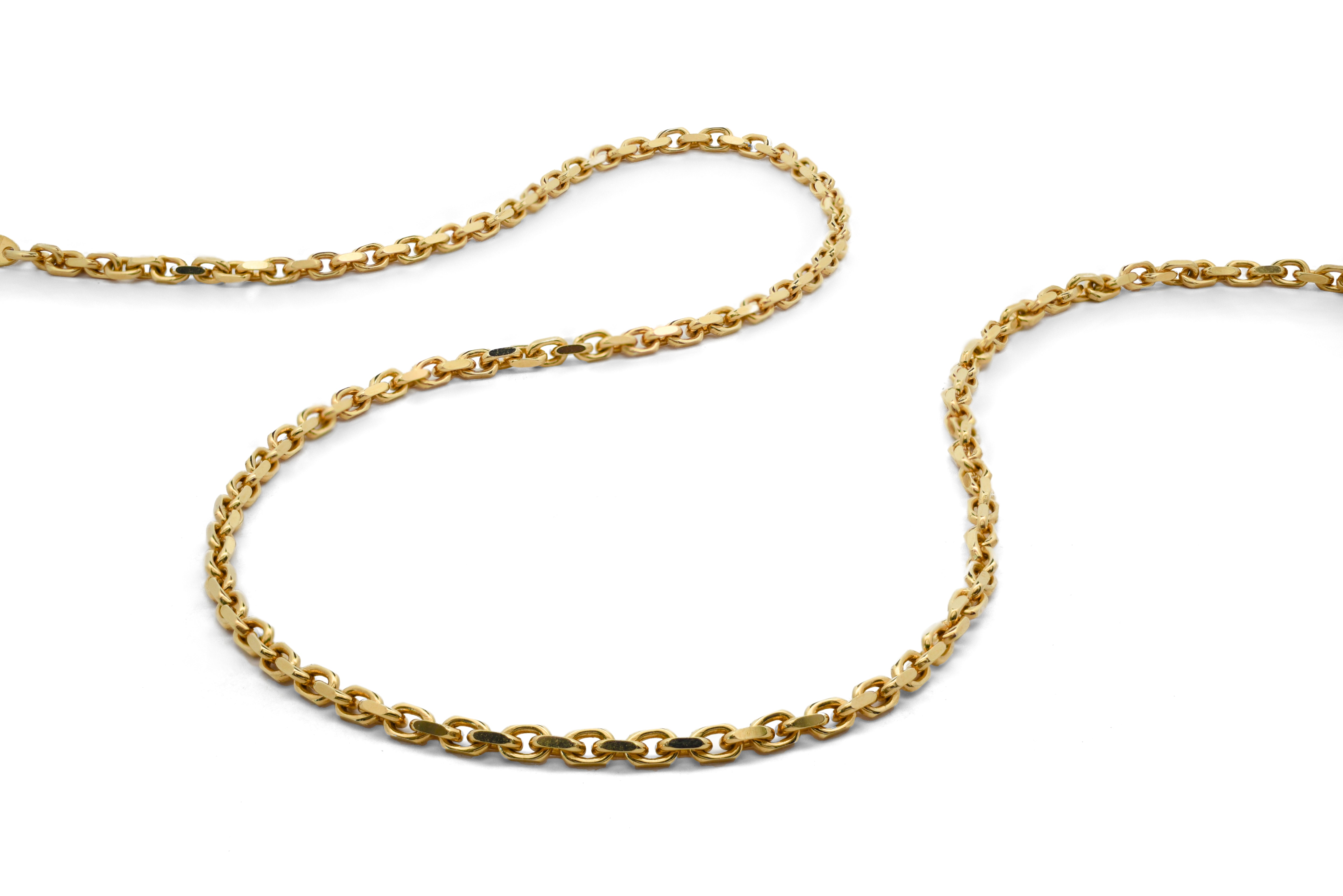 Gold chain necklace on a white background