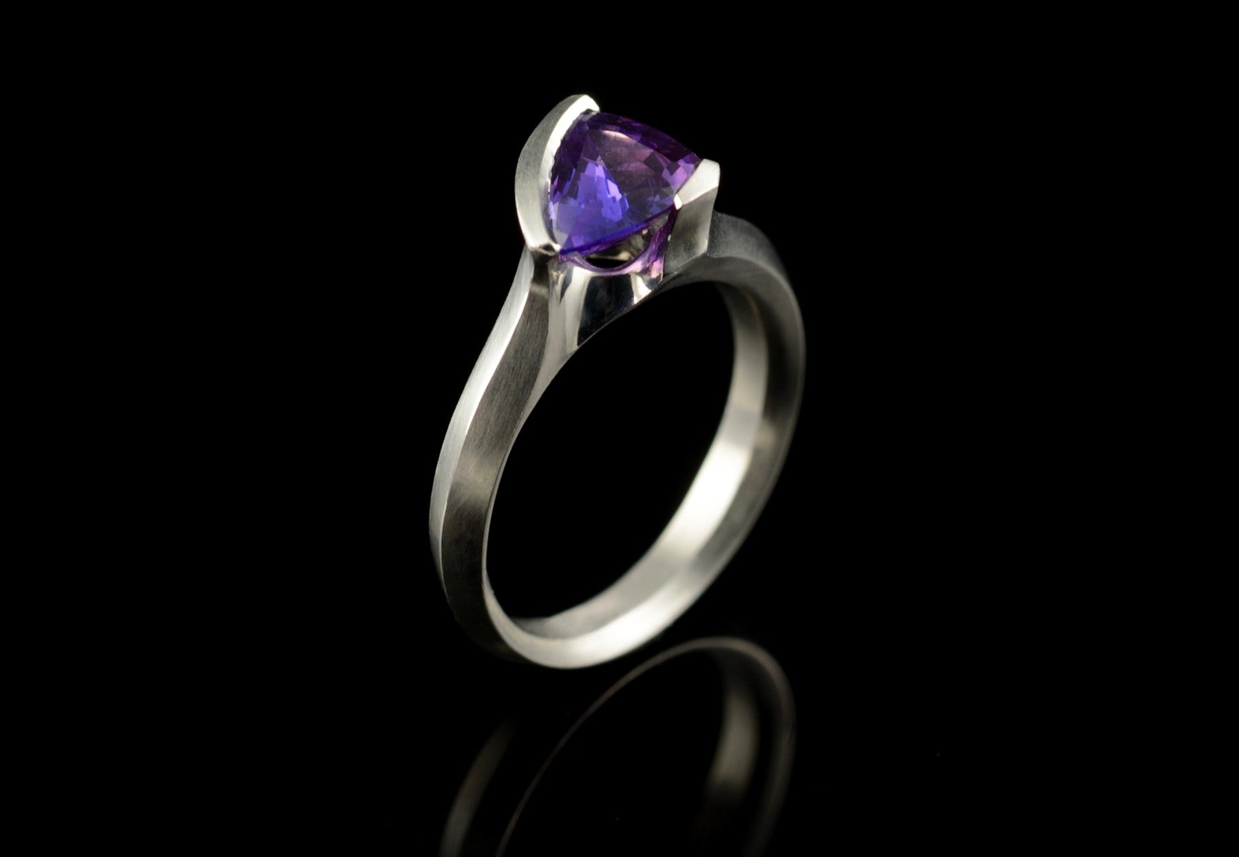Arris trillion cut purple sapphire and platinum ring