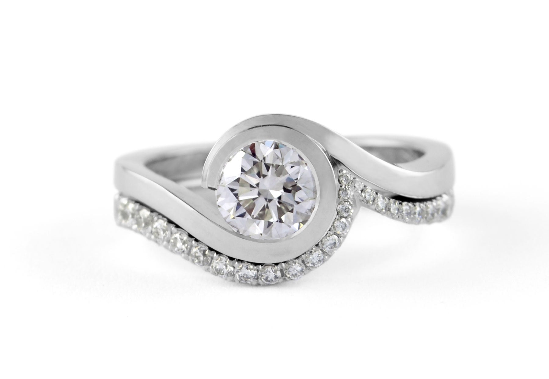 White diamond and platinum wave engagement ring and wedding ring set