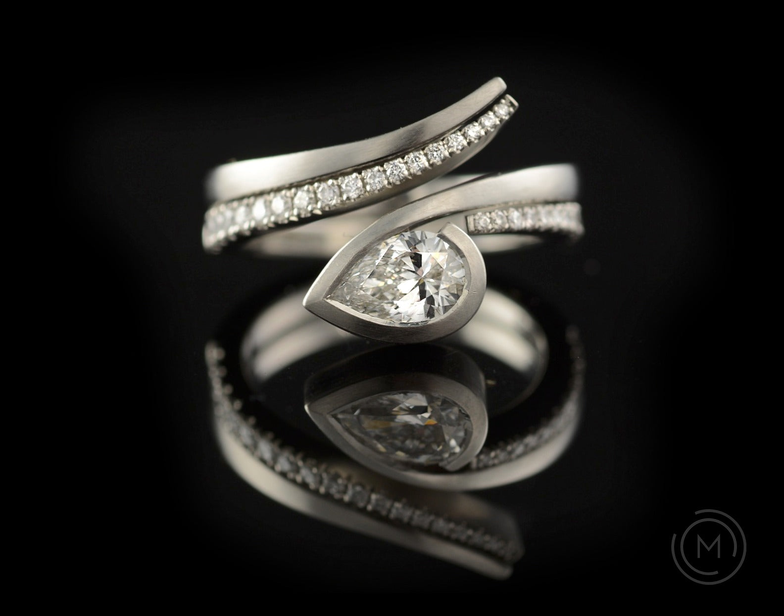 Twist white diamond and platinum engagement ring with fitted pave set white diamond wedding ring