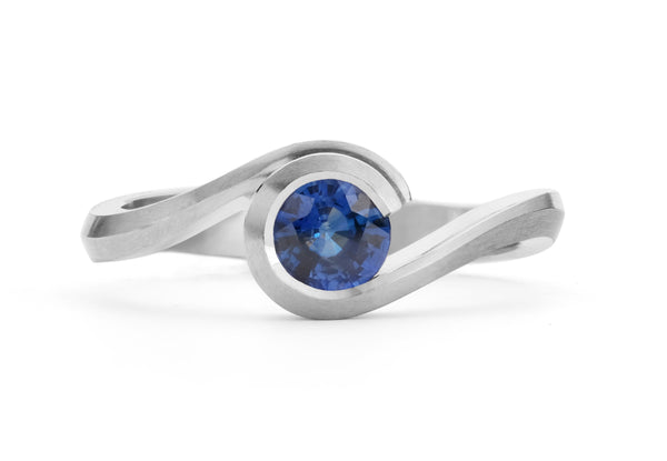 Platinum and blue sapphire Wave engagement ring