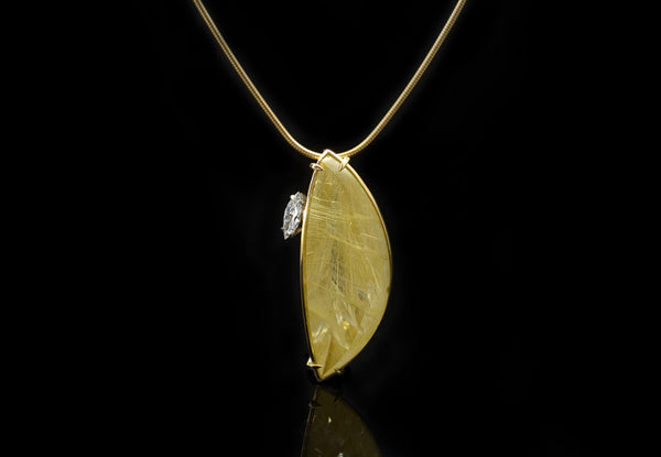 Gold, diamond and rutilated quartz pendant