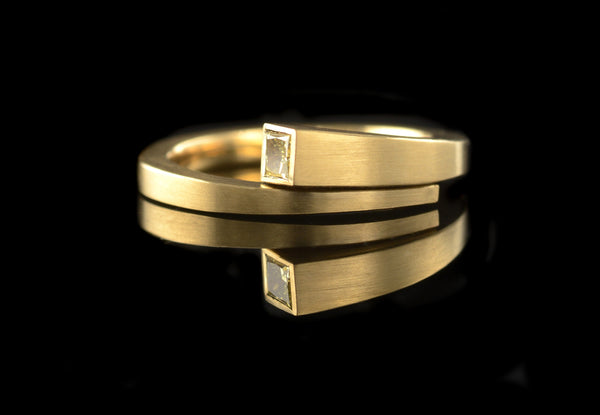 Forged yellow gold ring with princess cut yellow diamond