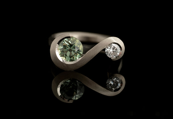Carved white gold statement ring with green sapphire and white diamond
