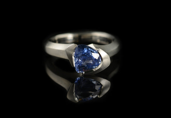 Carved platinum and trillion sapphire cocktail ring