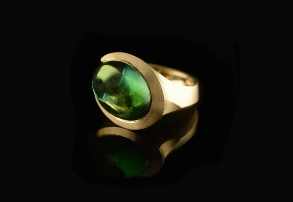 Cabochon tourmaline and carved rose gold cocktail ring