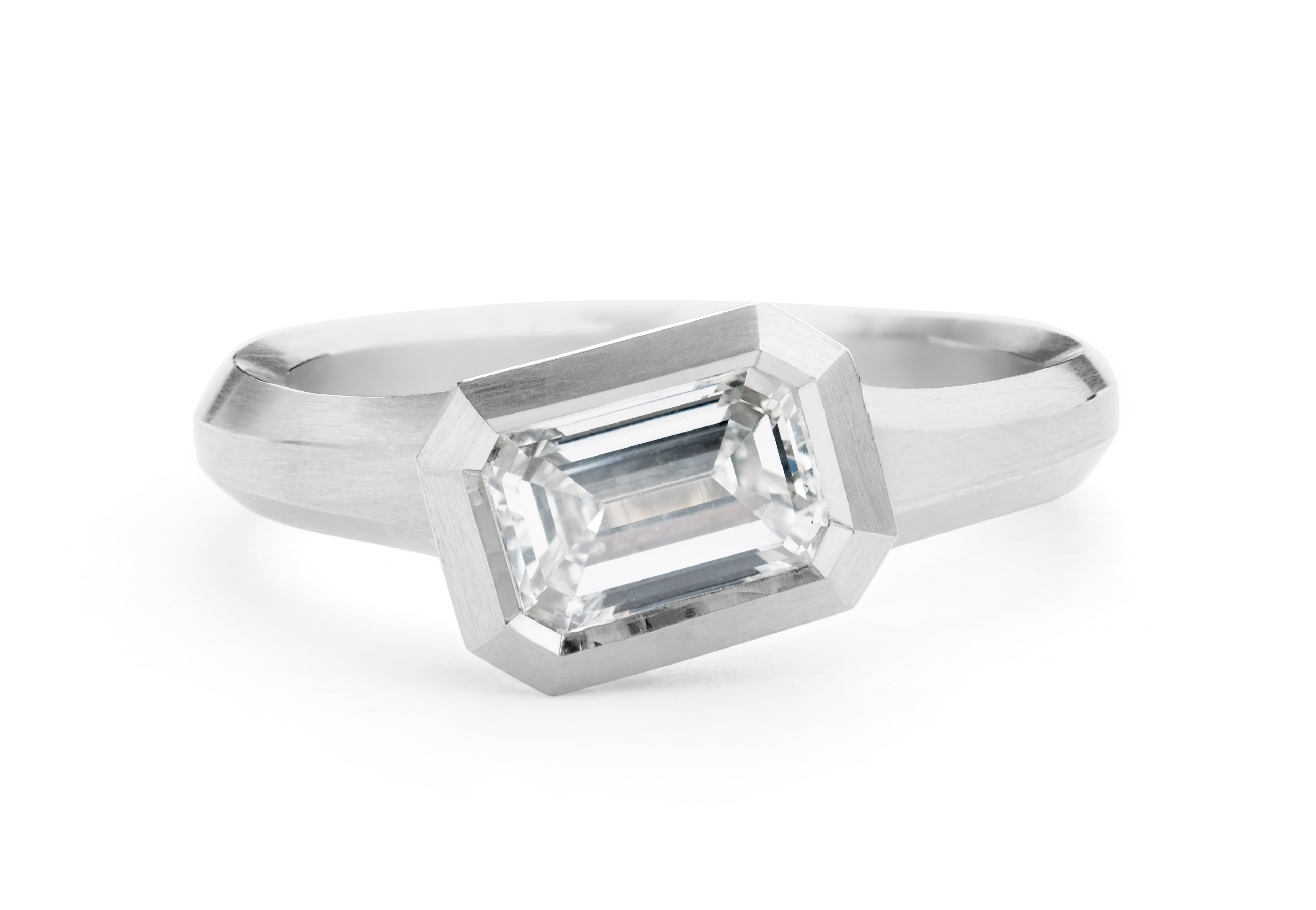 Arris modern platinum engagement ring with emerald-cut white diamond