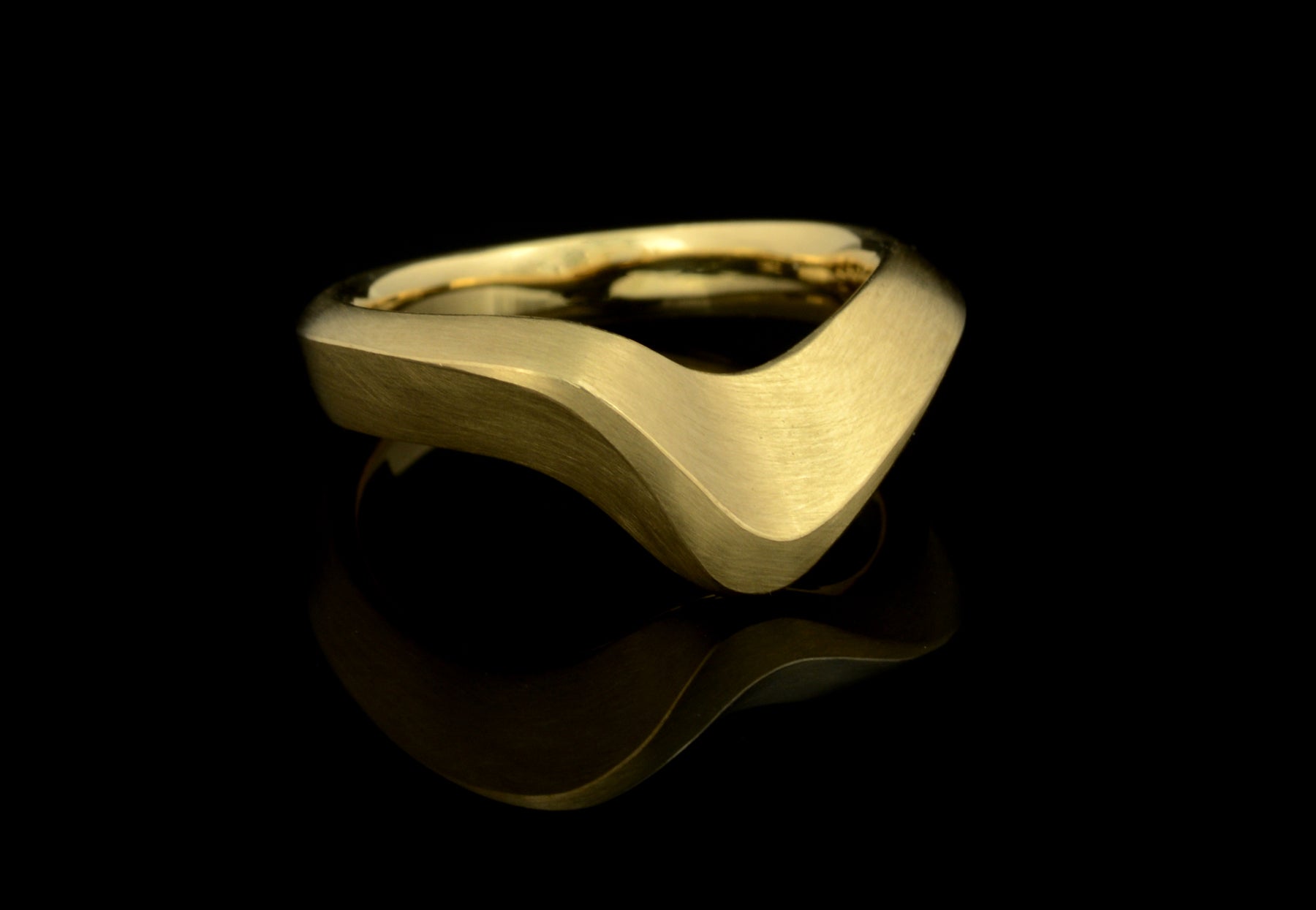Arris carved yellow gold wedding ring