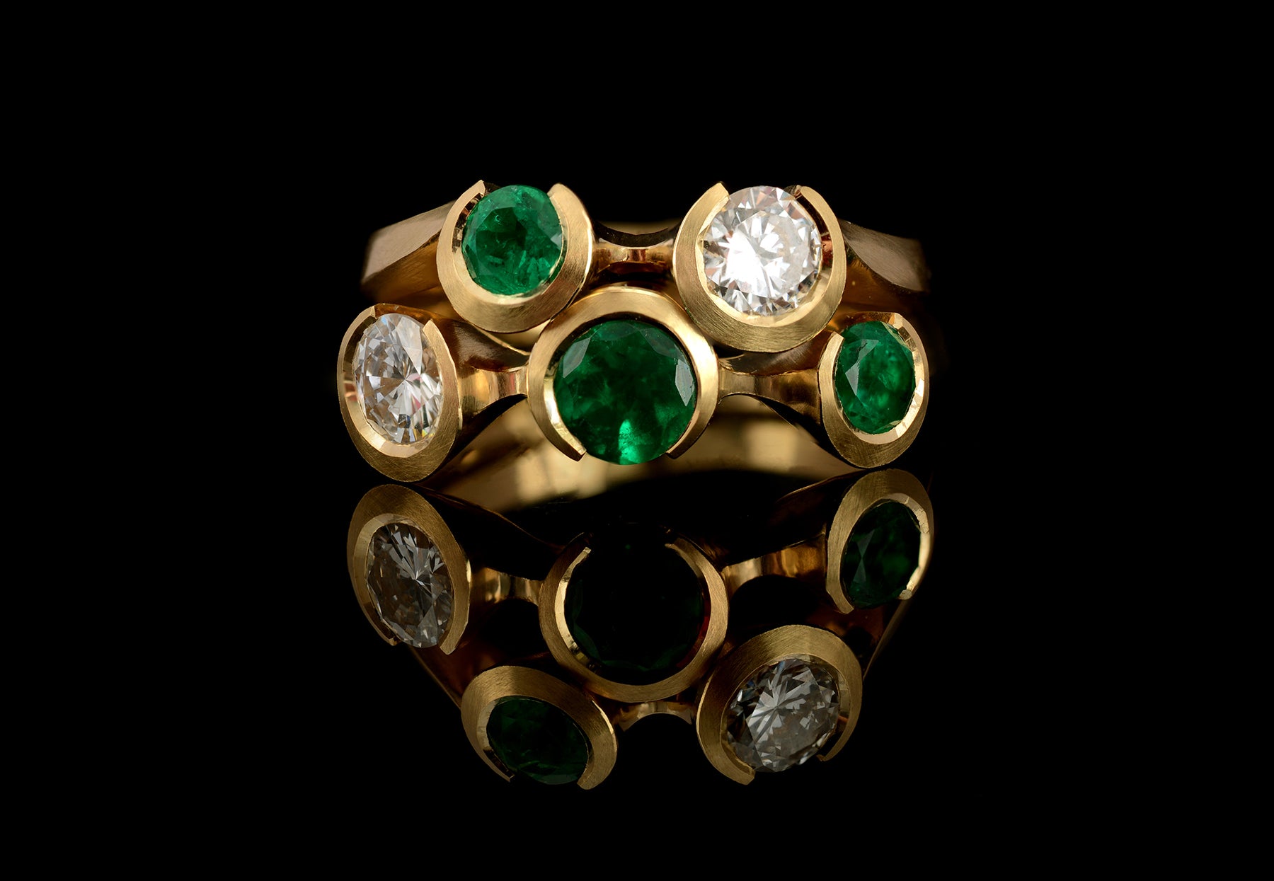 Arris emerald and white diamond yellow fitted rings