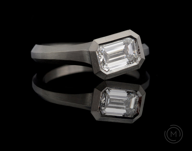 Arris emerald cut white diamond platinum engagement ring