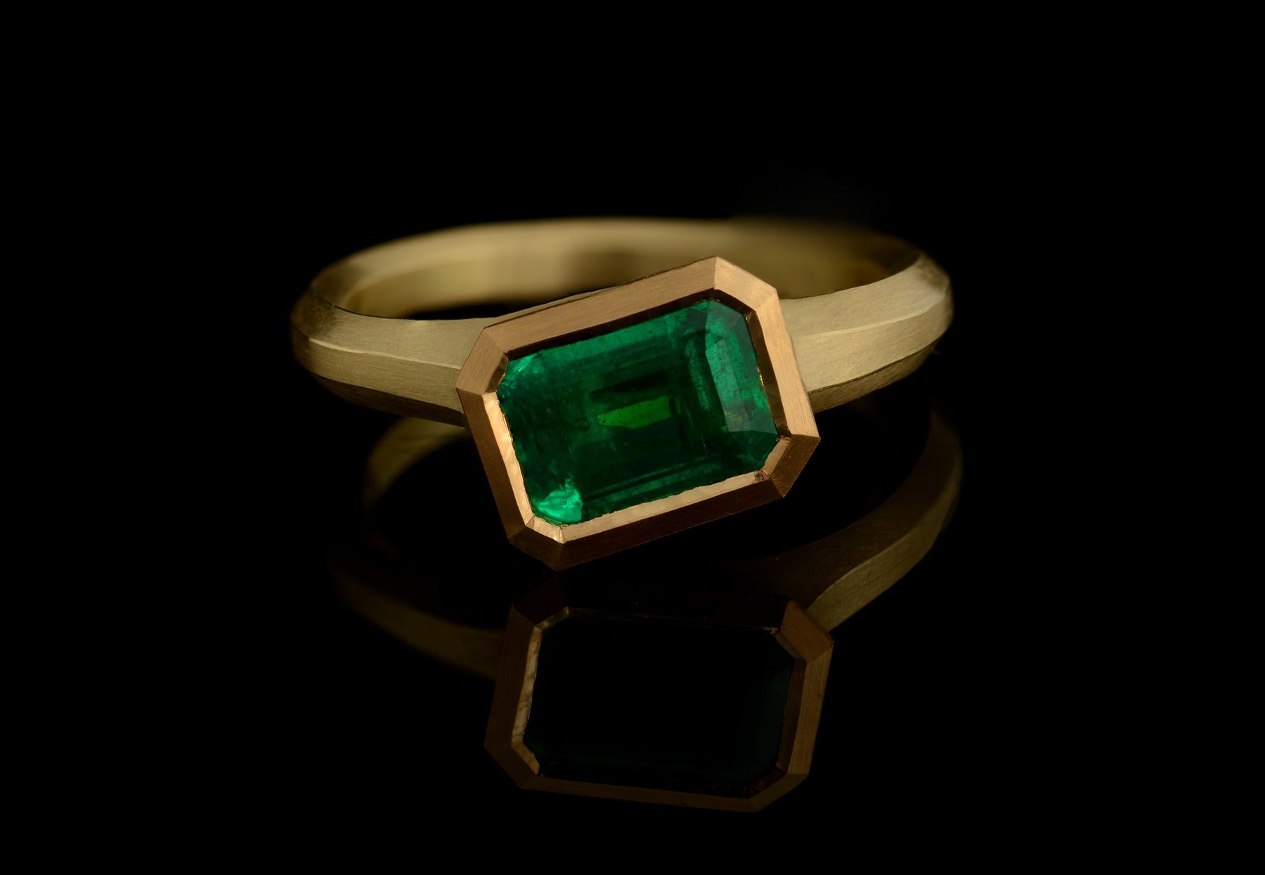 Arris emerald cut emerald and yellow gold ring