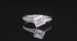 Arris contemporary platinum engagement ring with emerald-cut white diamond