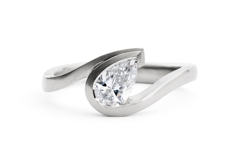 Wave-ring-platinum-pearshape-white-diamond