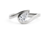 Wave platinum pear shape white diamond engagement ring