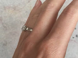 Arris modern platinum engagement ring with emerald-cut white diamond