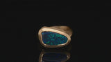 Arris carved yellow gold cocktail ring with asymmetric black opal