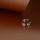 Open platinum ring set with yellow and white diamonds
